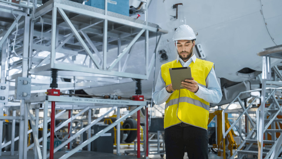 An engineer holding a tablet computer